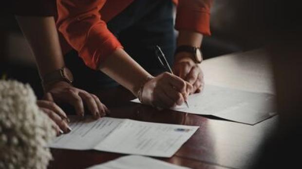Signing paperwork image
